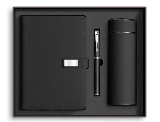 Black leather notebook and pen
