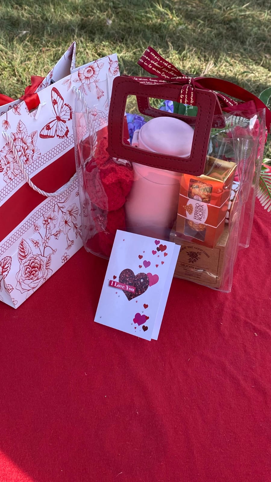 Cards and a box on a red surface