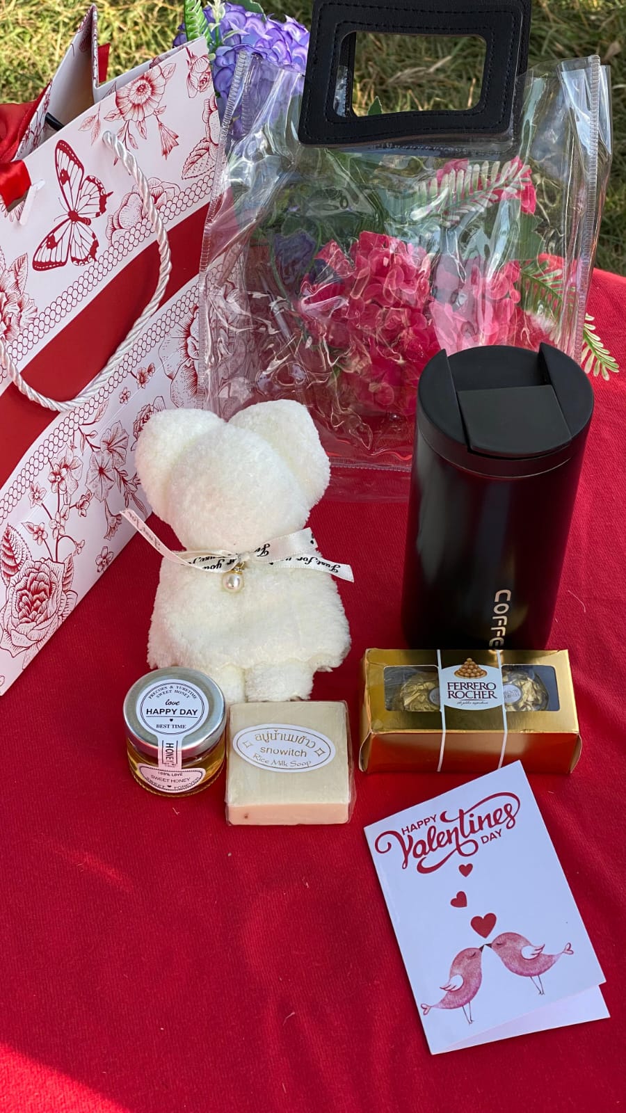 Chocolates and a card on a red tablecloth