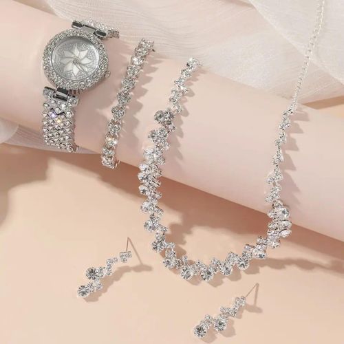 Necklace, earrings on softpink background 