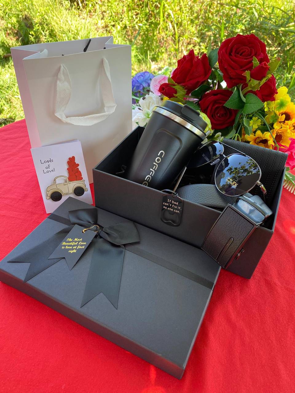 Open black gift box with a coffee cup