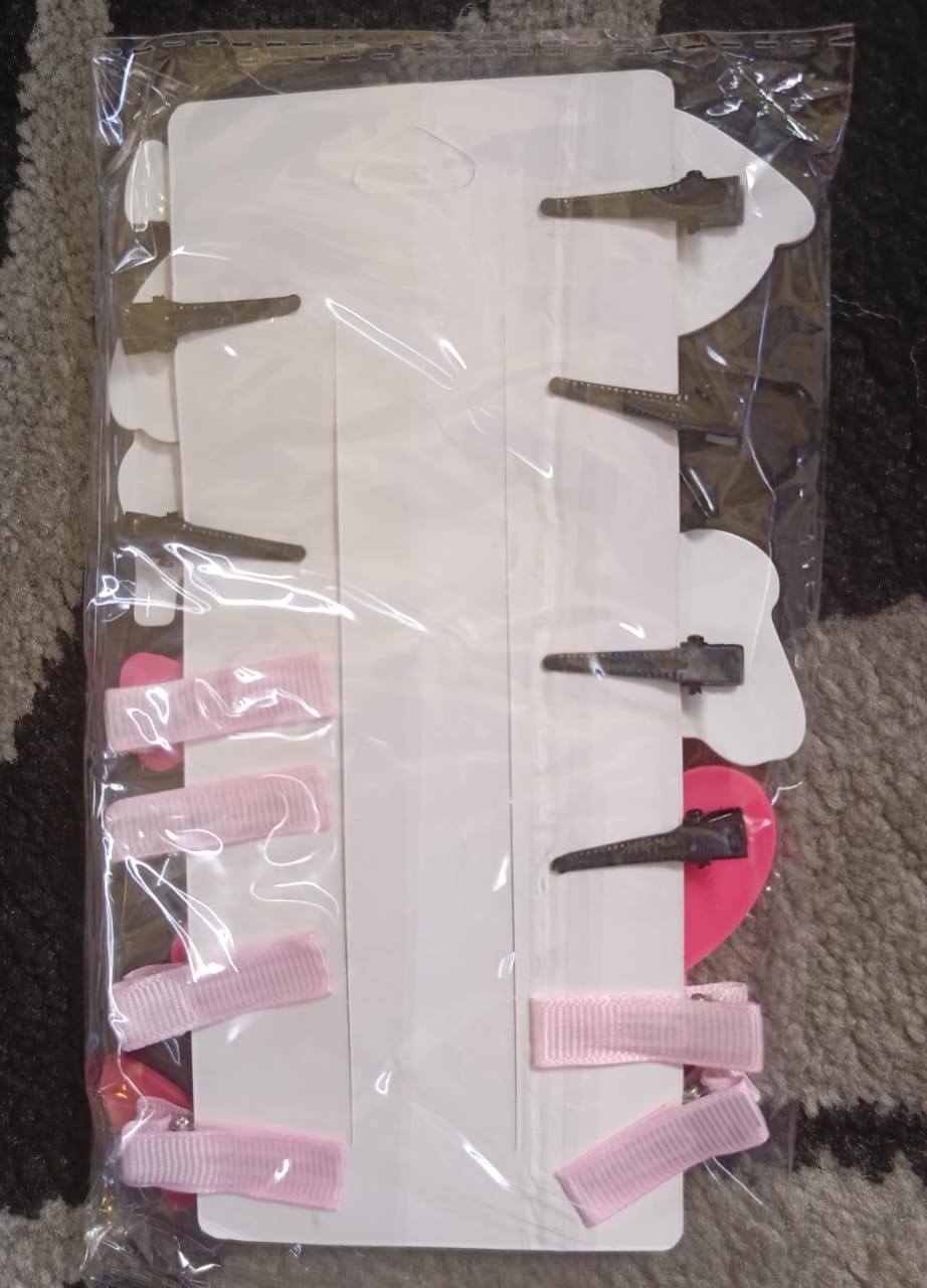 Set of hair clips including pink and black 