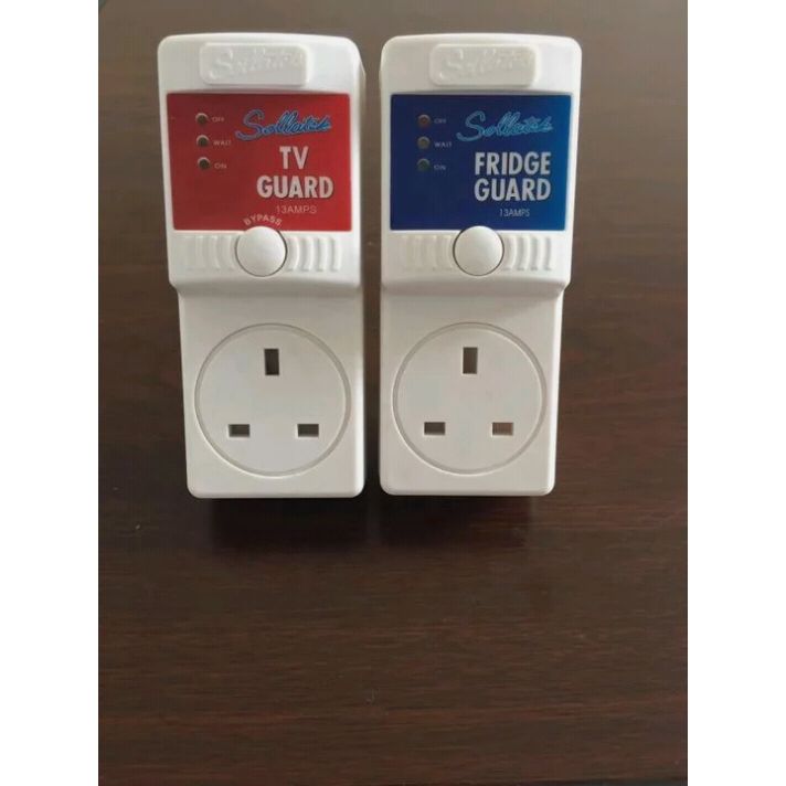 Two electrical surge protectors labeled 'Tv Guard' and 'Fridge Guard'