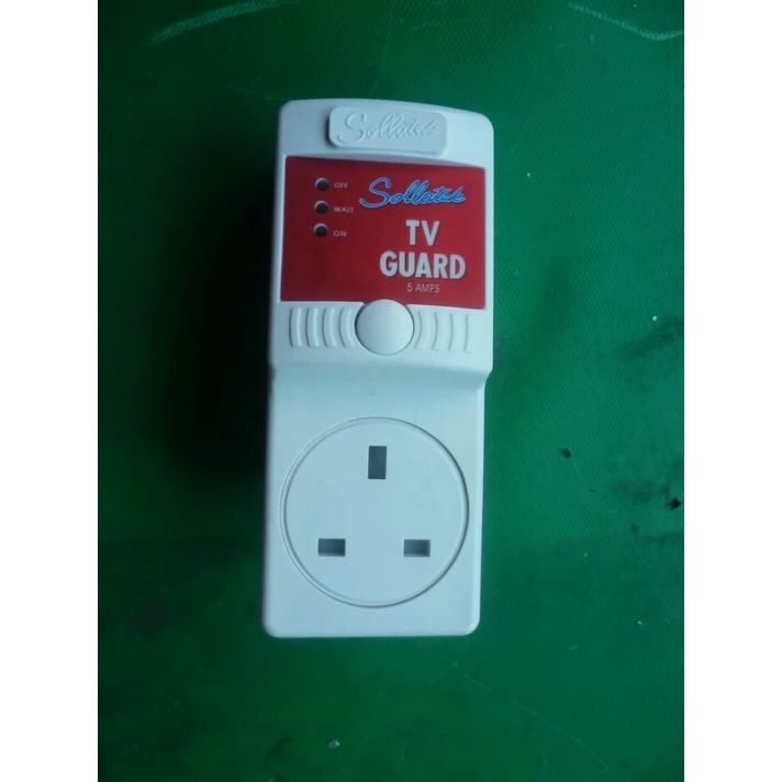 White TV Guard' device with red labeled on green background